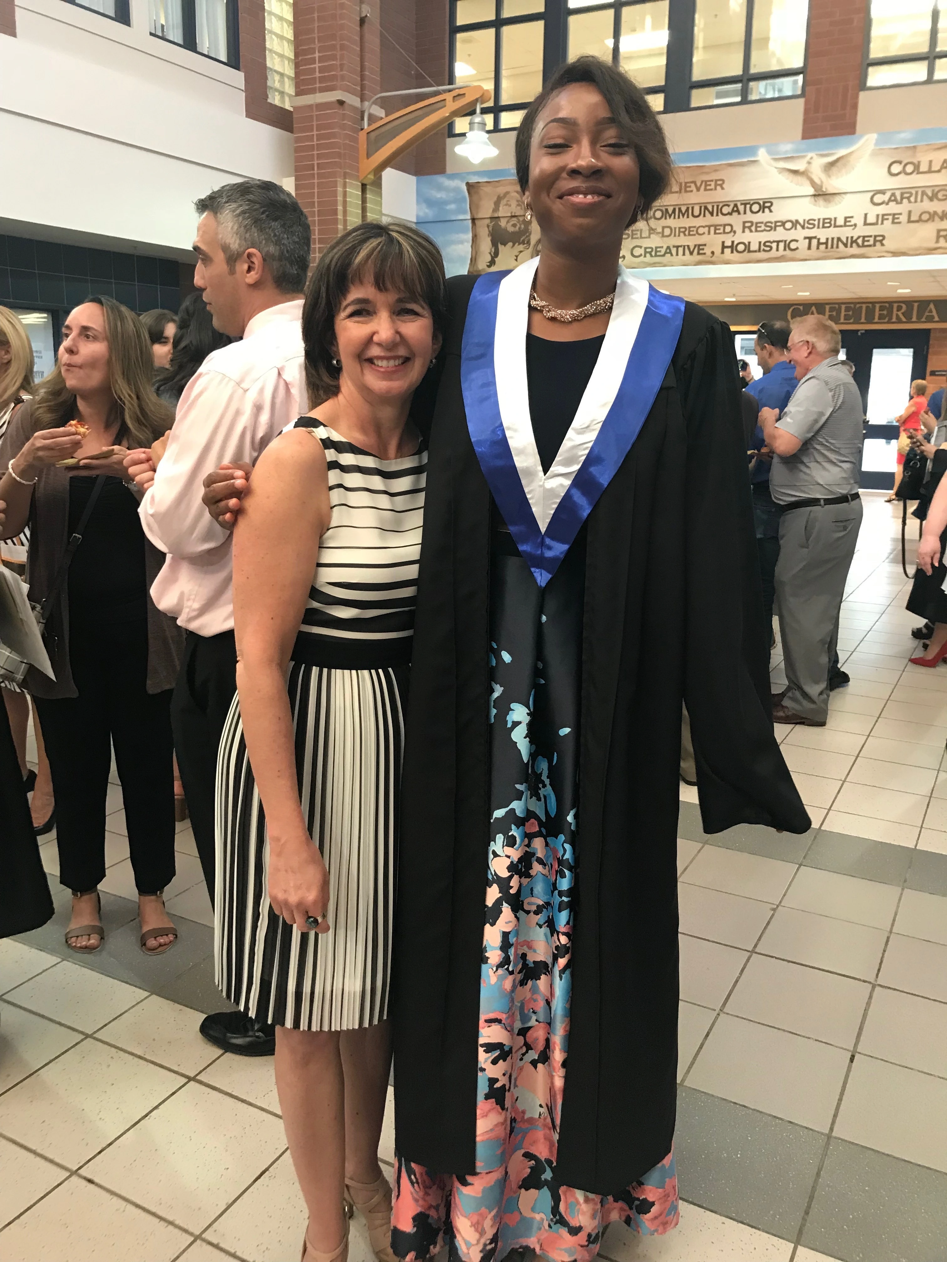 Patricia Robinson with a student at their graduation